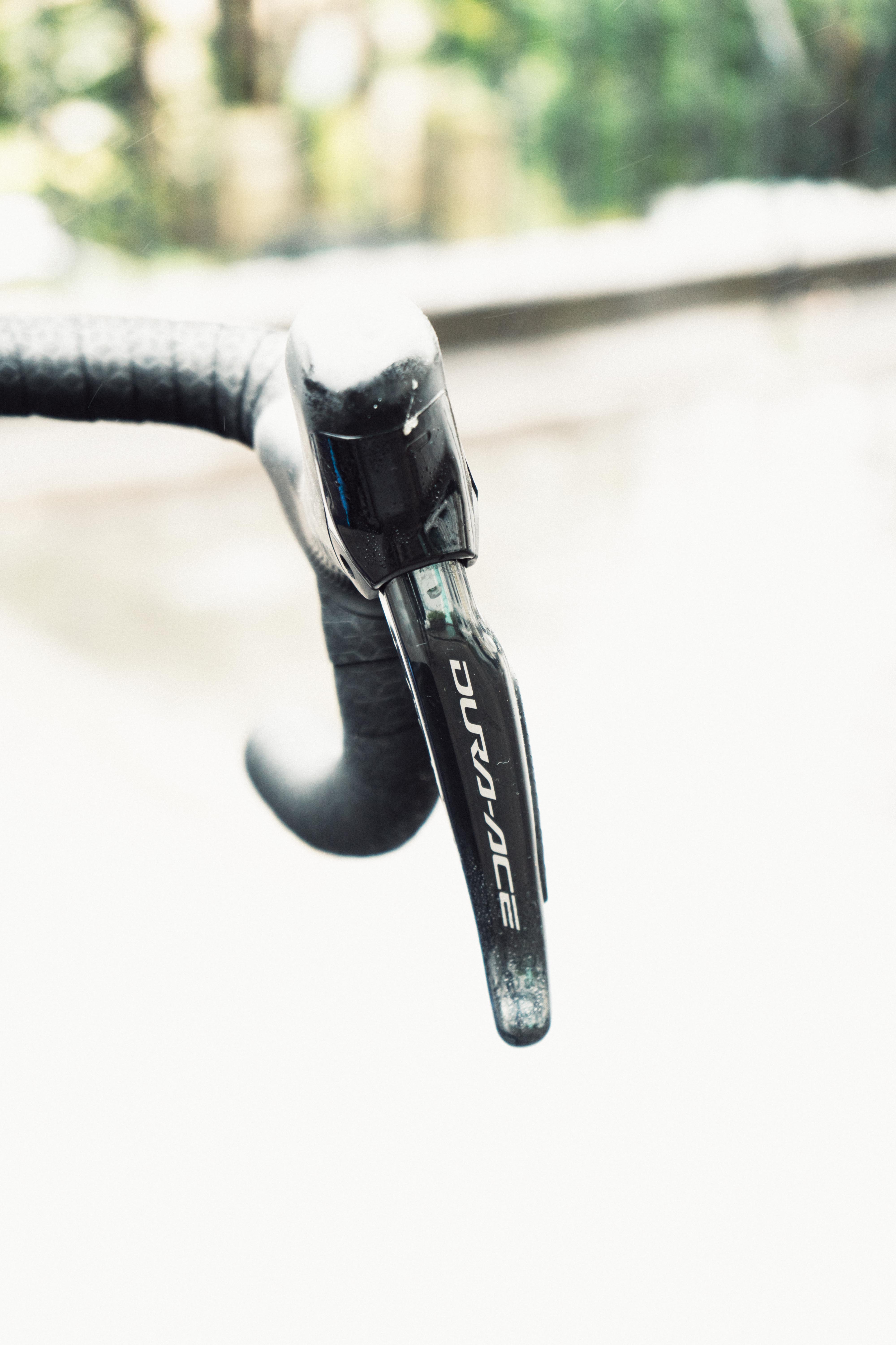 A close up of a bikes brake lever