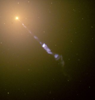 The Hubble Space Telescope captured an enormous relativistic jet, in blue, emerging from the supermassive black hole at the center of galaxy M87. (The galaxy itself appears as a bright point in the image, with the black hole too small to see.) The black hole's second jet extends in the other direction, and is hidden from view.