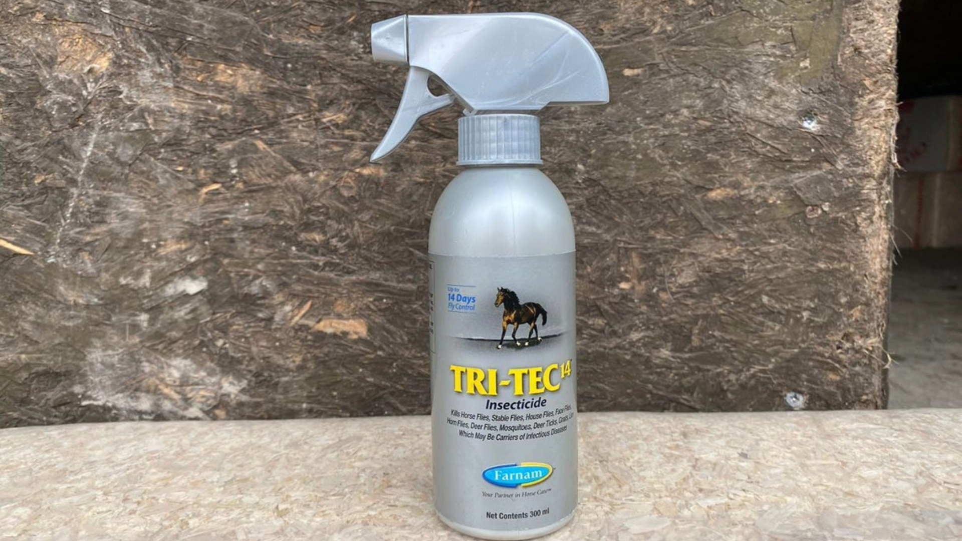 Farnam Tri-Tec 14 Insecticide, one of the best fly sprays for horses on a stone background