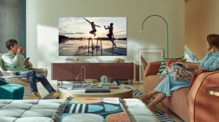 Samsung QN90A Neo QLED TV watched by two people in a modern living room