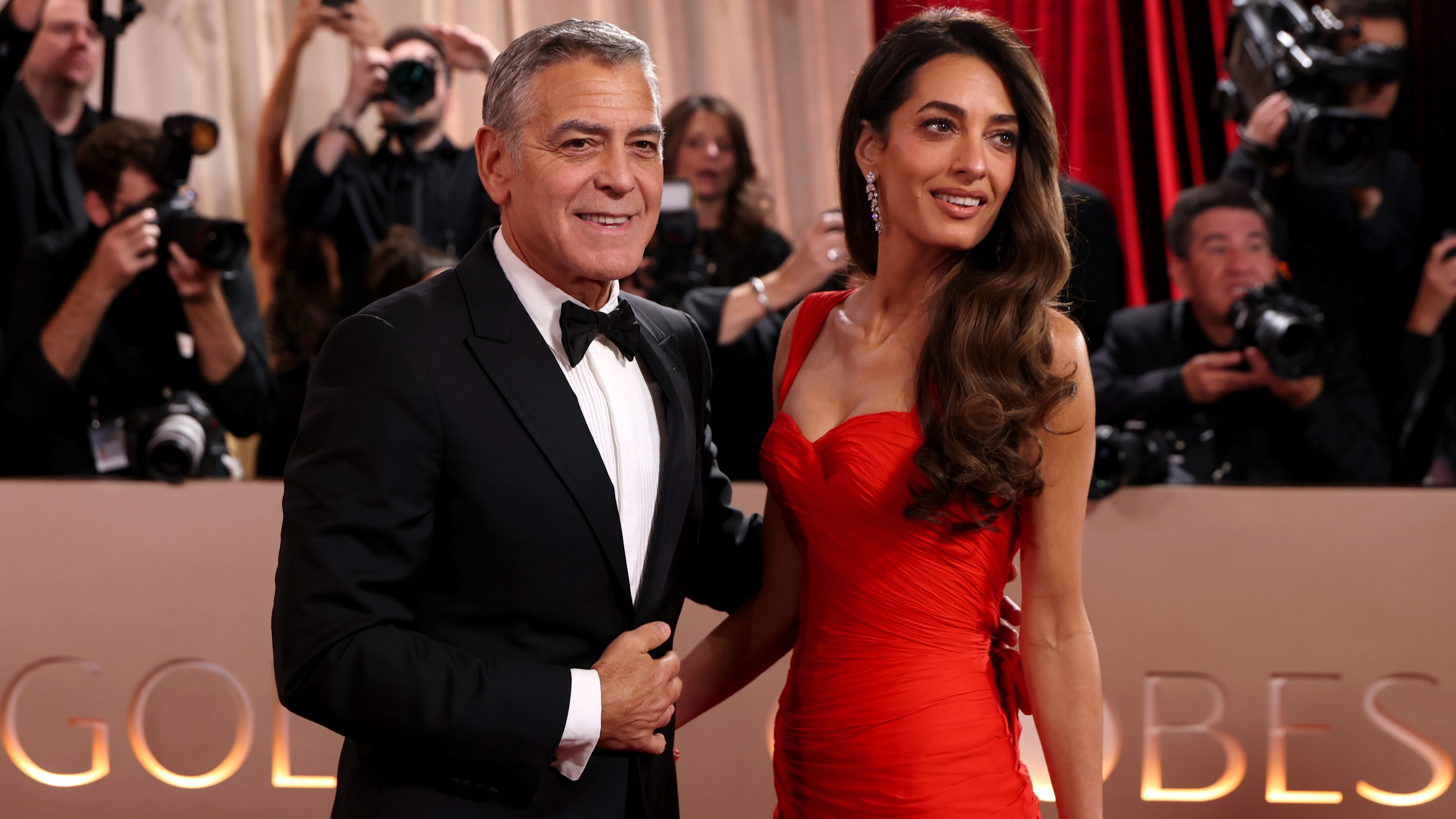 Amal and George Clooney on the 2026 golden globes red carpet 