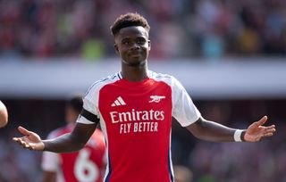 Bukayo Saka of Arsenal celebrates scoring his team's second goal during the Premier League match between Arsenal FC and Wolverhampton Wanderers FC at Emirates Stadium on August 17, 2024 in London, England.