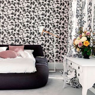 bedroom with monochrome look and bouquet of flowers