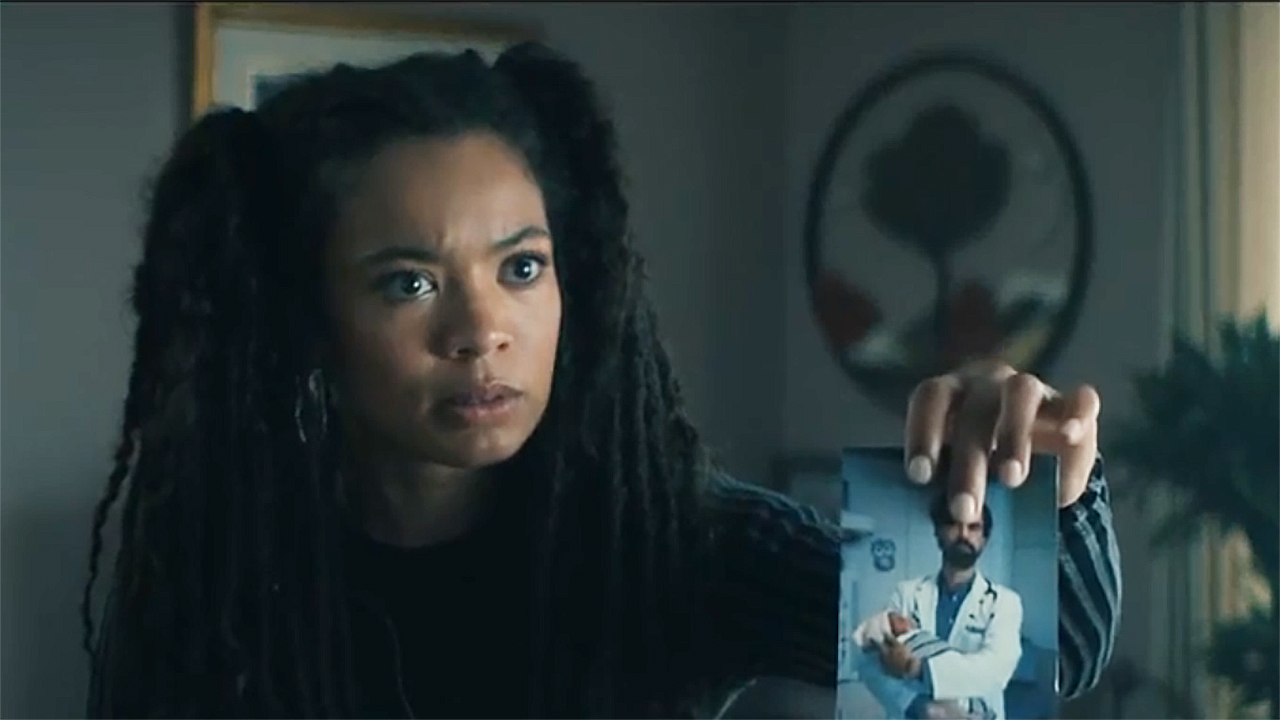 A surprised Marie holding up a picture of Cipher/Doctor Gould in Gen V season 2 episode 3