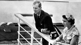Queen Elizabeth II and her husband Prince Philip, Duke of Edinburgh, on the bridge of the liner Gothic as it arrves at the Miraflores Locks in the Panama Canal during the Royal Tour of the Commonwealth. 30th November 1953.