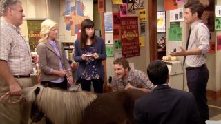 The Parks and Recreation cast admiring Lil Sebastian, a miniature horse 