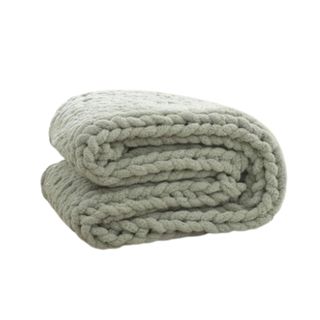 A green knitted throw