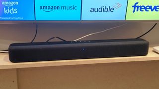 The Amazon Fire TV Soundbar on a shelf.