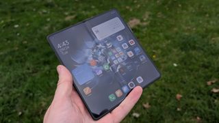 xiaomi mix fold 4 review images showing off the phone from multiple angles