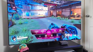 LG OLED G4 with game hub menu active and Overwatch 2 gameplay on display