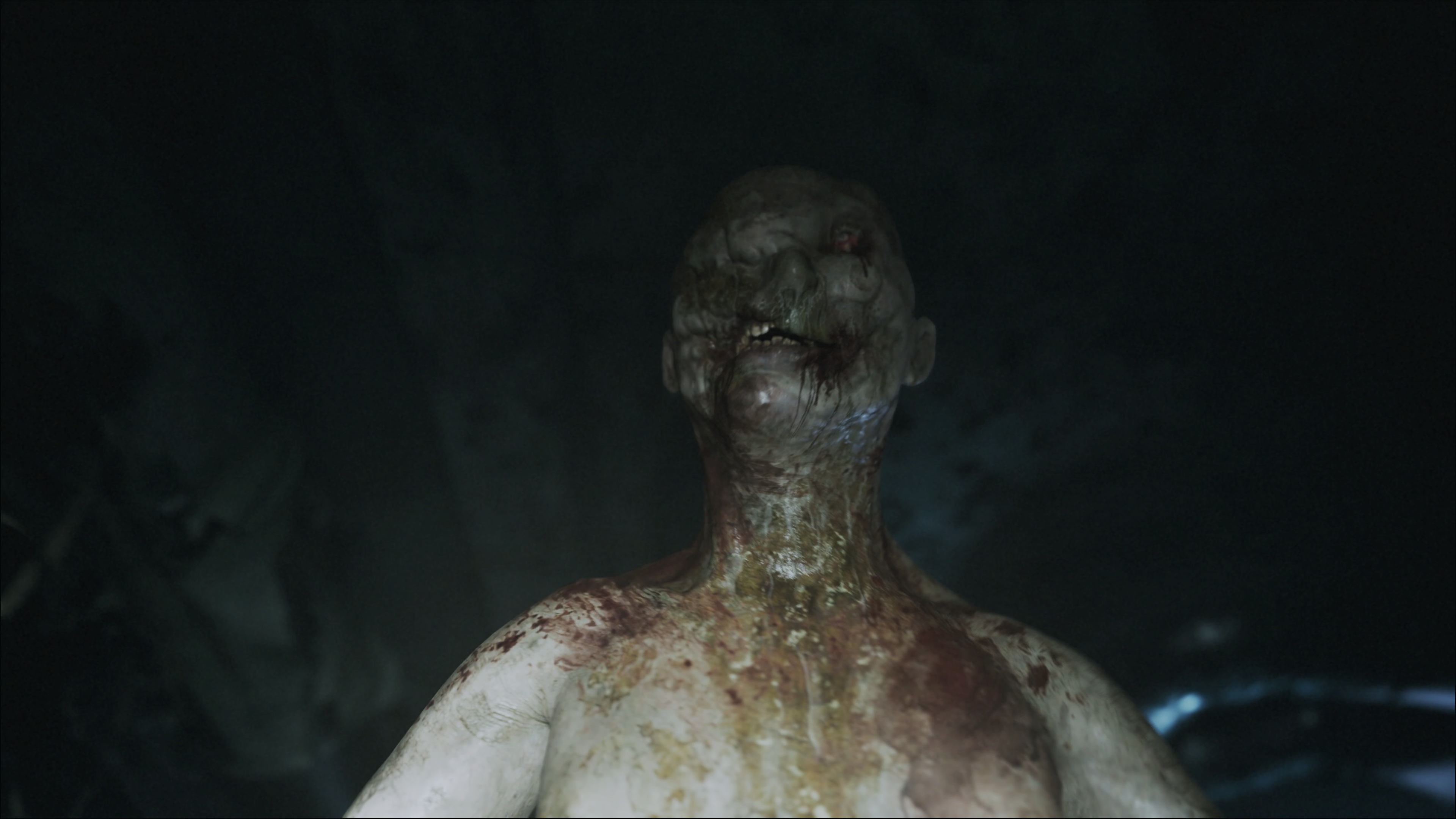 ILL screenshot showing a humanoid figure covered in bodily fluids walking in a very dark corridor