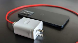 OnePlus Nord N300 5G 33W charger next to the phone