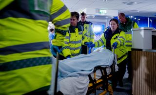 Paramedics help the lake survivors