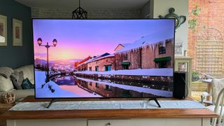 TCL P755K 65-inch 4K TV on wooden furniture in a living room