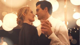 Against a bright background Carolyn Bessette (Sarah Pidgeon) and JFK Jnr (Paul Kelly) gaze into each others eyes while slow dancing in Ryan Murphy's new series Love Story.