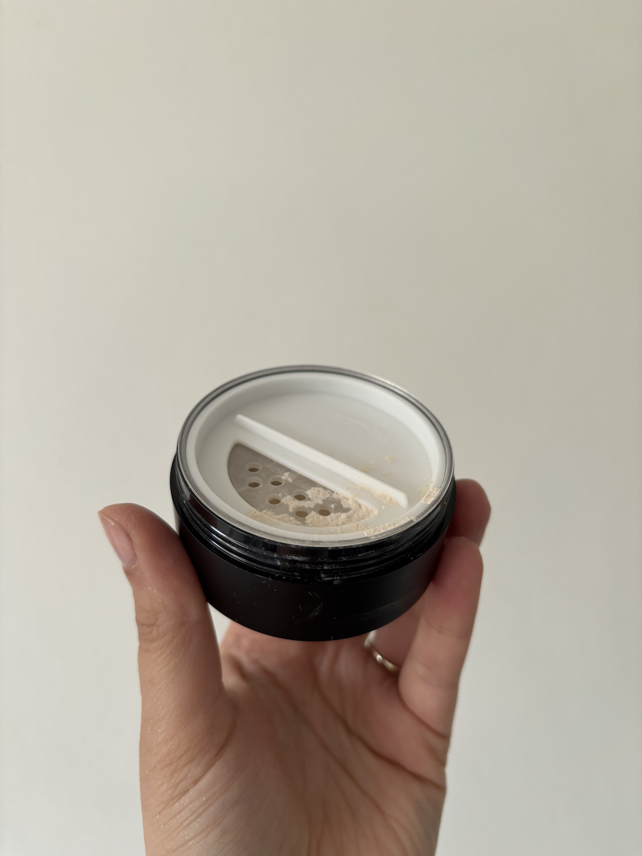 Mica Ricketts holding Milk Makeup Pore Eclipse Matte Translucent Setting Powder