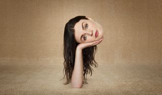 This Way Up Season 2: a shot of Áine&#039;s (Aisling Bea) disembodied head being held up by a hand that is sticking up out of the ground 