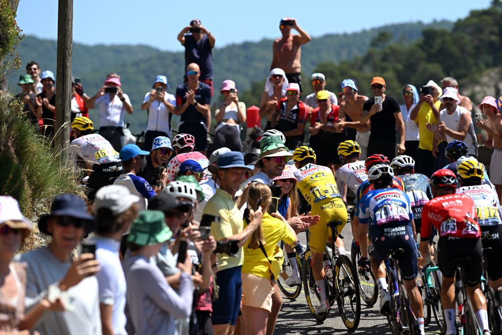 NICE FRANCE JULY 20 Tadej Pogacar of Slovenia and UAE Team Emirates Yellow Leader Jersey competes while fans cheers during the 111th Tour de France 2024 Stage 20 a 1328km stage from Nice to Col de la Couillole 1676m UCIWT on July 20 2024 in Nice France Photo by Dario BelingheriGetty Images
