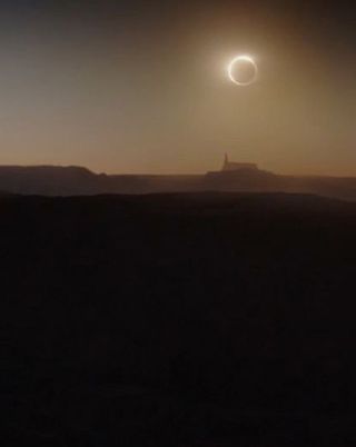 The Death Star eclipses a sun in the Star Wars film "Rogue One: A Star Wars Story."