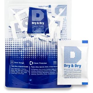 A packet of 100 Dry & Dry 2 Gram Silica Gel Packets Desiccants in a blue and white bag