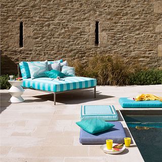 pool side garden with colourful seating