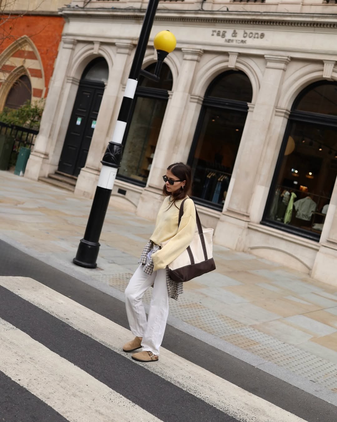 Alice in jumper, jeans and Birkenstocks