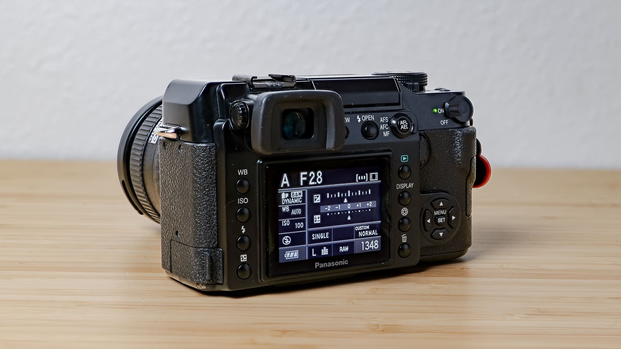 A photo of the Lumix L1 DSLR on a wooden surface