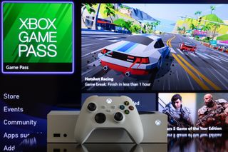 Xbox Series S console and controller in front of the Xbox Game Pass home screen
