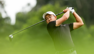 Lee Chieh-po hits a driver and watches its flight