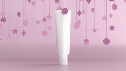  cosmetic haircare tube on urple background with confetti