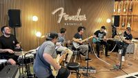 A number of guitarists jam at Fender's new Nashville HQ