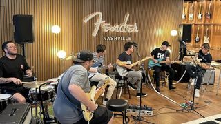 A number of guitarists jam at Fender's new Nashville HQ