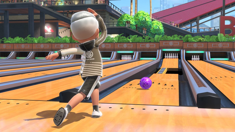 A Mii sends a bowling ball down a course with a portion of the lane missing in Nintendo Switch Sports.