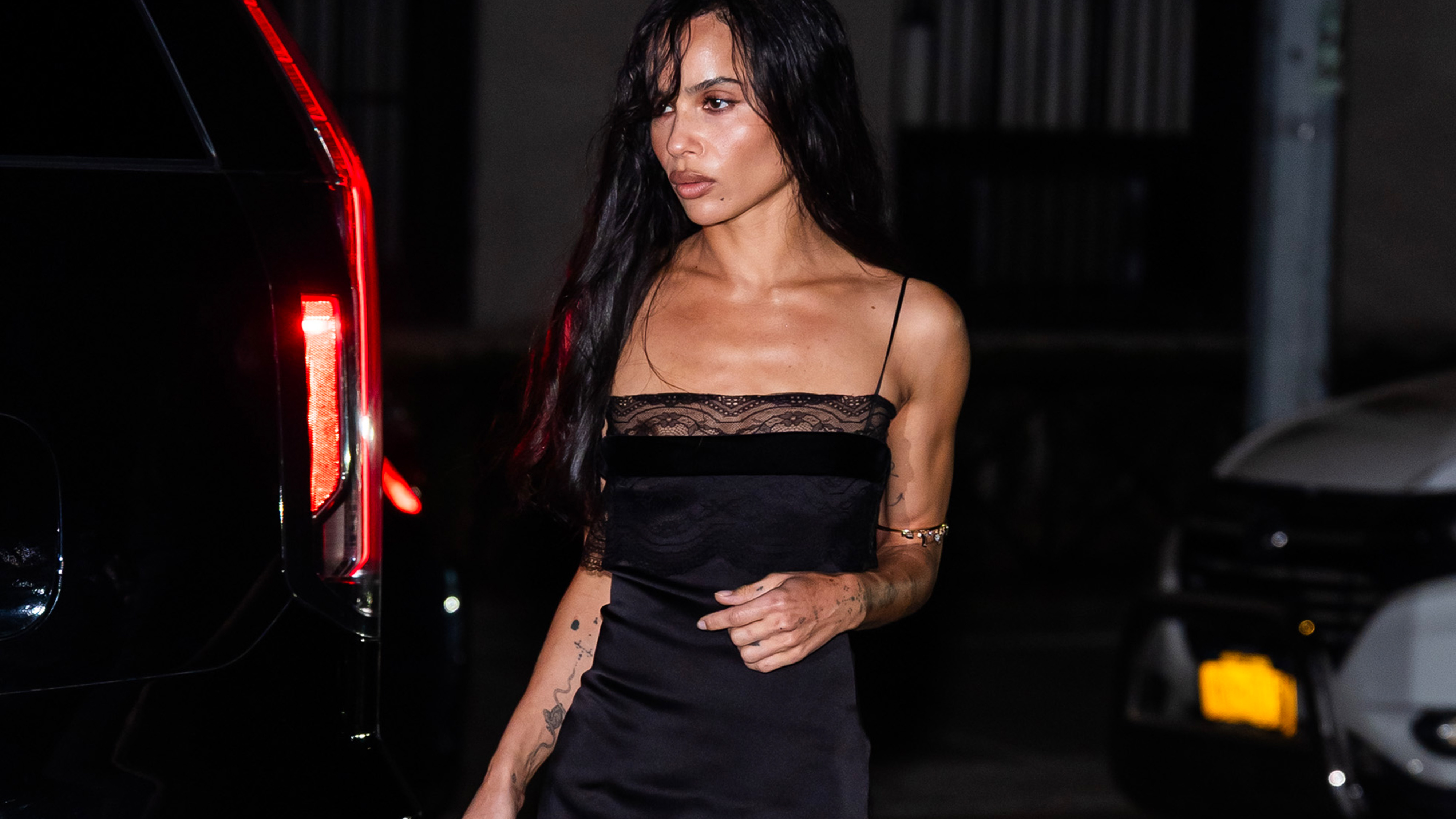 Zoe Kravitz attending an event in New York City in a black slip dress.