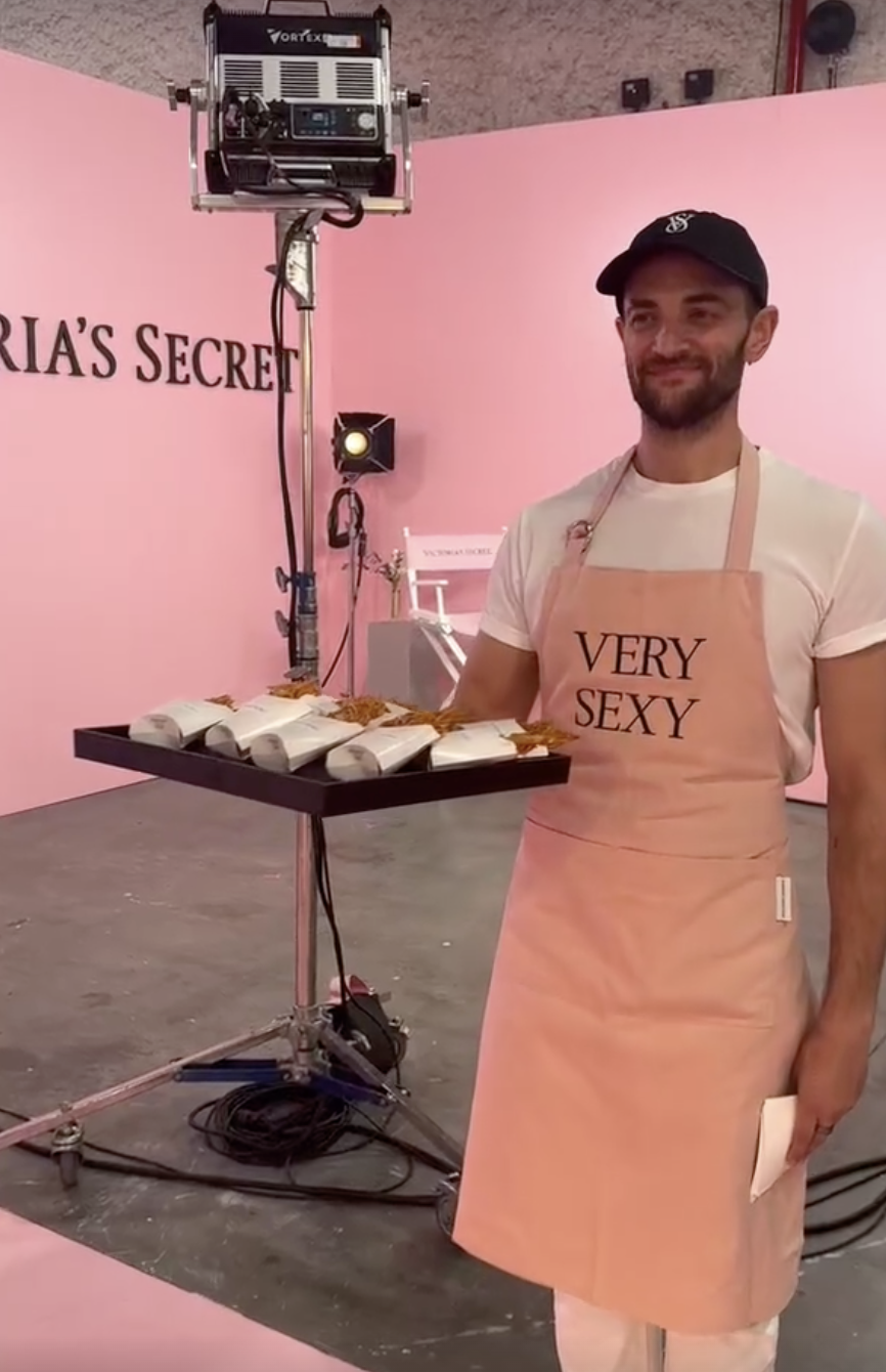 Waiters wearing Victoria&#039;s Secret aprons