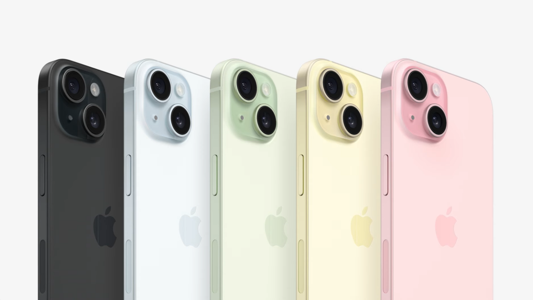 The iPhone 15 in five shades, black, blue, green, yellow, and pink