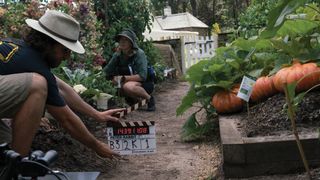 In Sydney’s Centennial Park, a vegetable garden set is readied for filming