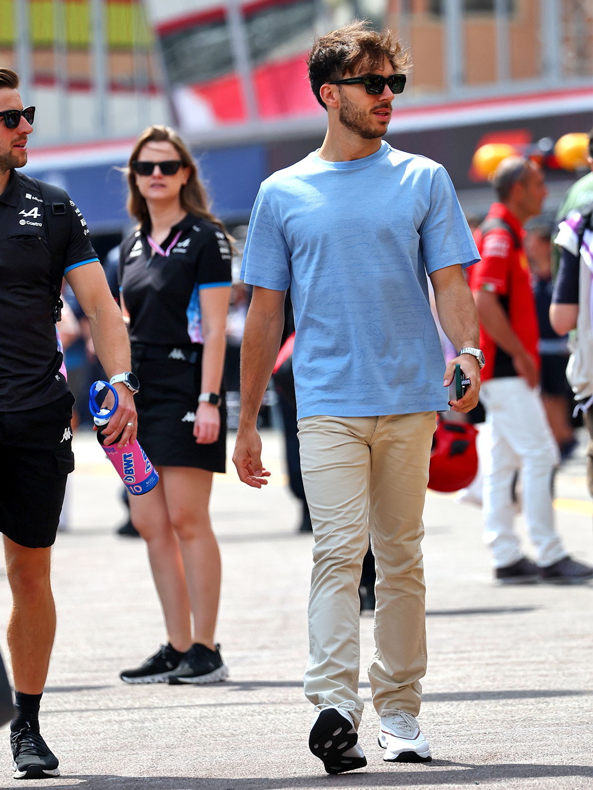 Pierre Gasly wearing a Berluti blue shirt and khaki trousers with sneakers at the Monaco Grand Prix.