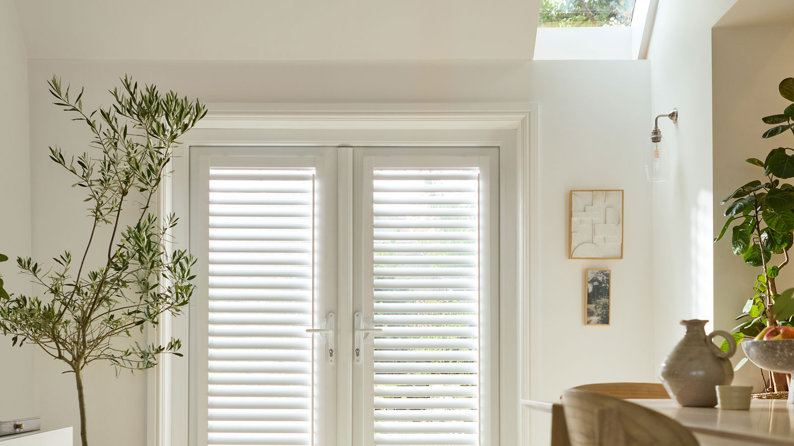 doors with integrated blinds in room with rooflight