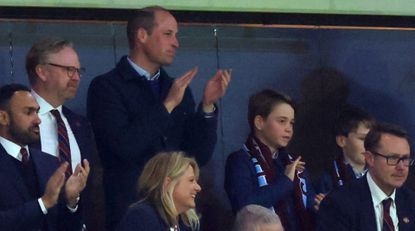  Prince William, Prince of Wales and Prince George of Wales look on alongside Tyrone Mings of Aston Villa during the UEFA Europa Conference League 2023/24 Quarter-final first leg match between Aston Villa and Lille OSC at Villa Park on April 11, 2024 in Birmingham, England.