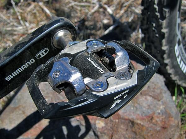 Shimano has replaced the previous Deore XT SPD clipless pedal with two different versions as with XTR: a slimmer and lighter Race version that features additional surface contact area and better mud clearance along with this Trail variant with sizeable (and durable) alloy platform to better support softer-soled shoes.