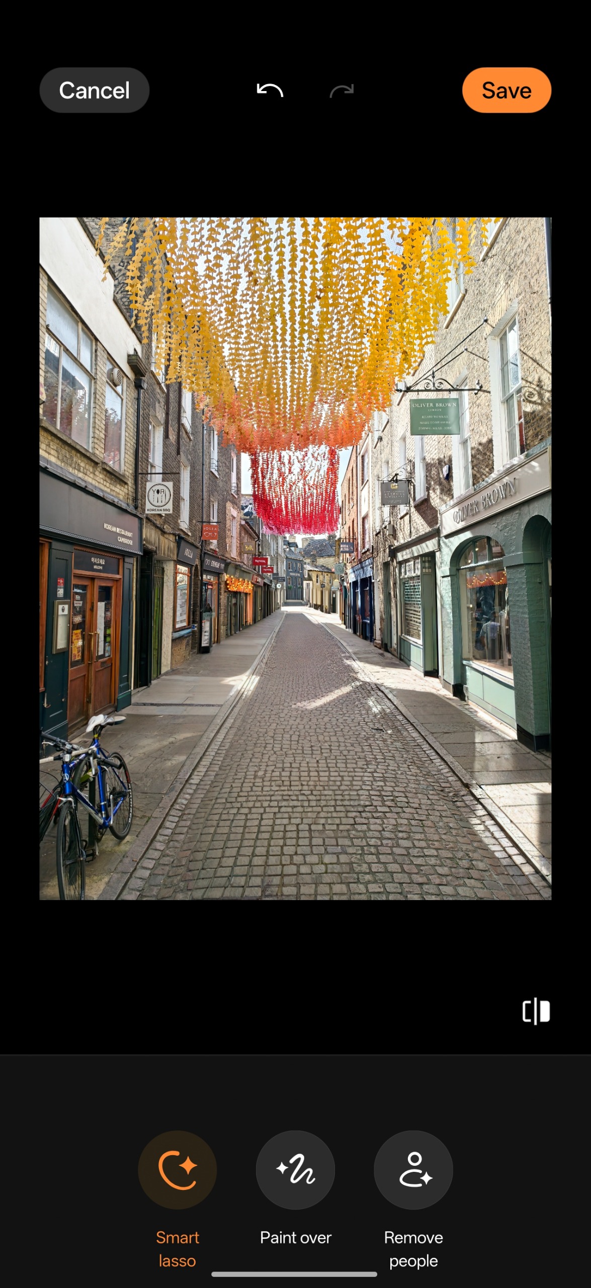 AI Eraser result showing the same decorated street after the people have been removed.