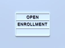 ''Open Enrollment'' Written White Lightbox Sitting On Blue Background