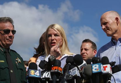 Florida Attorney General Pam Bondi and Gov. Rick Scott