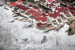 Storm surge and high waves lash a resort on the Dutch Island of St. Maarten, which suffered a direct hit from Hurricane Irma on Sept. 6.