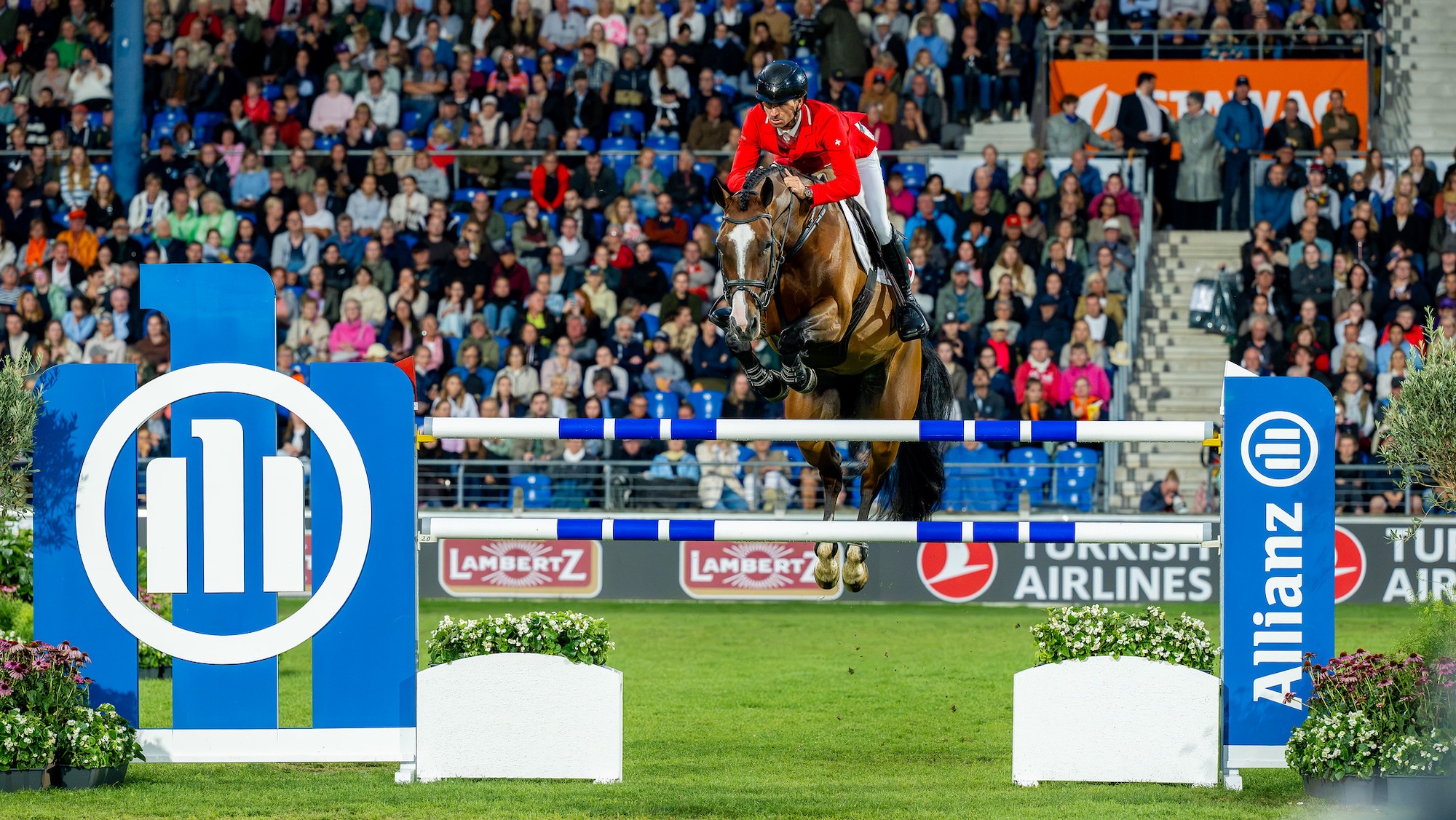 World showjumping champions Steve Guerdat and Dynamix De Belheme clear a vertical