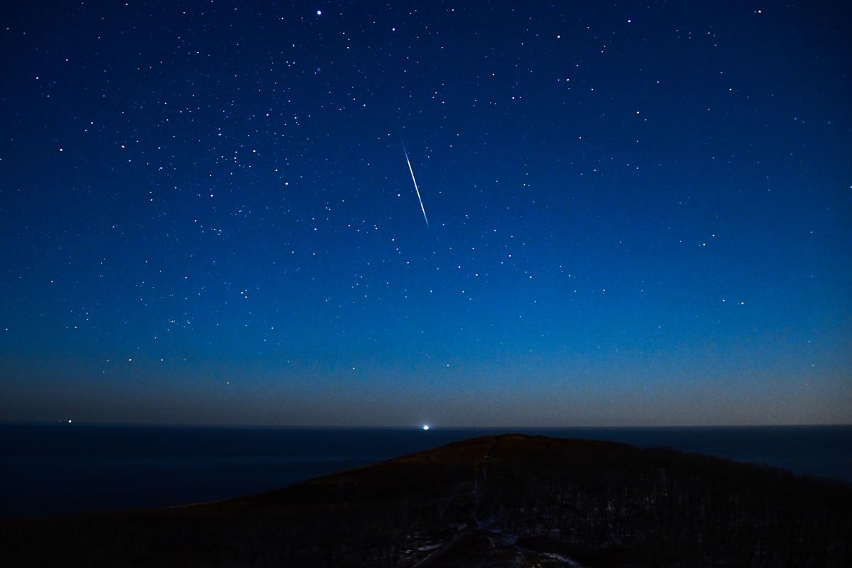  A view of the sky over Cape Vyatlina on Russky Island, Russia, during the peak of the 2021 Geminid meteor shower.