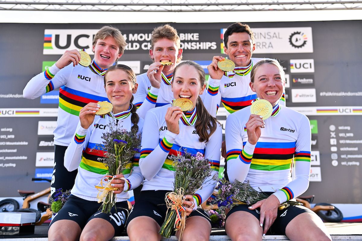 Picture by Will Palmer/SWpix.com - 28/08/2024 - Cycling - 2024 UCI Mountain Bike World Championships - Pal Arinsal, Arinsal, Andorra - Mixed Team Relay Podium - Brayden Johnson (USA), Nicholas Konecny (USA), Haley Batten (USA), Vida Lopez de San Roman (USA), Madigan Munro (USA), Christopher Blevins (USA) receiving the Gold Medal