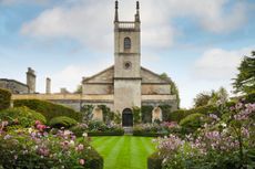 St Michael and All Angels church, framed by Japanese anemones and dahlias. Credit: Britt Willoughby Dyer