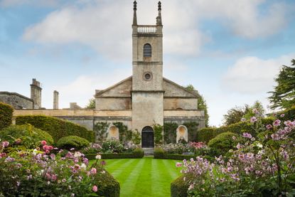 St Michael and All Angels church, framed by Japanese anemones and dahlias. Credit: Britt Willoughby Dyer